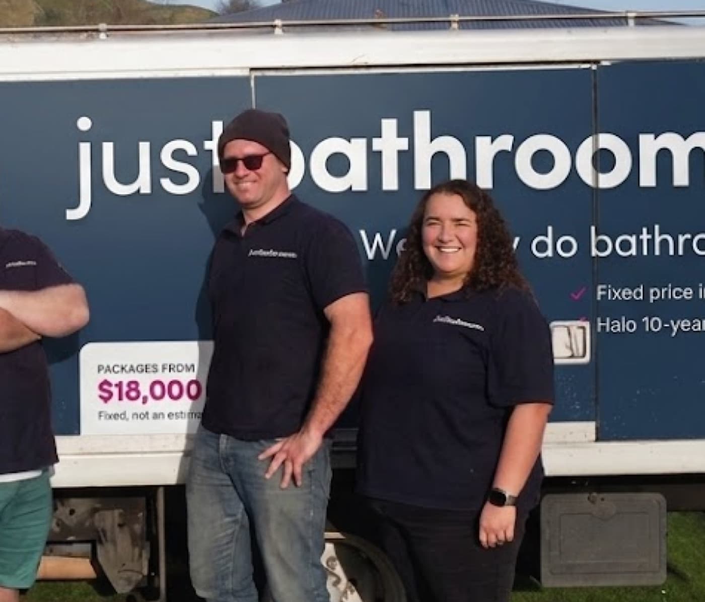 Jake and Faye standing in front of the Just Bathrooms van